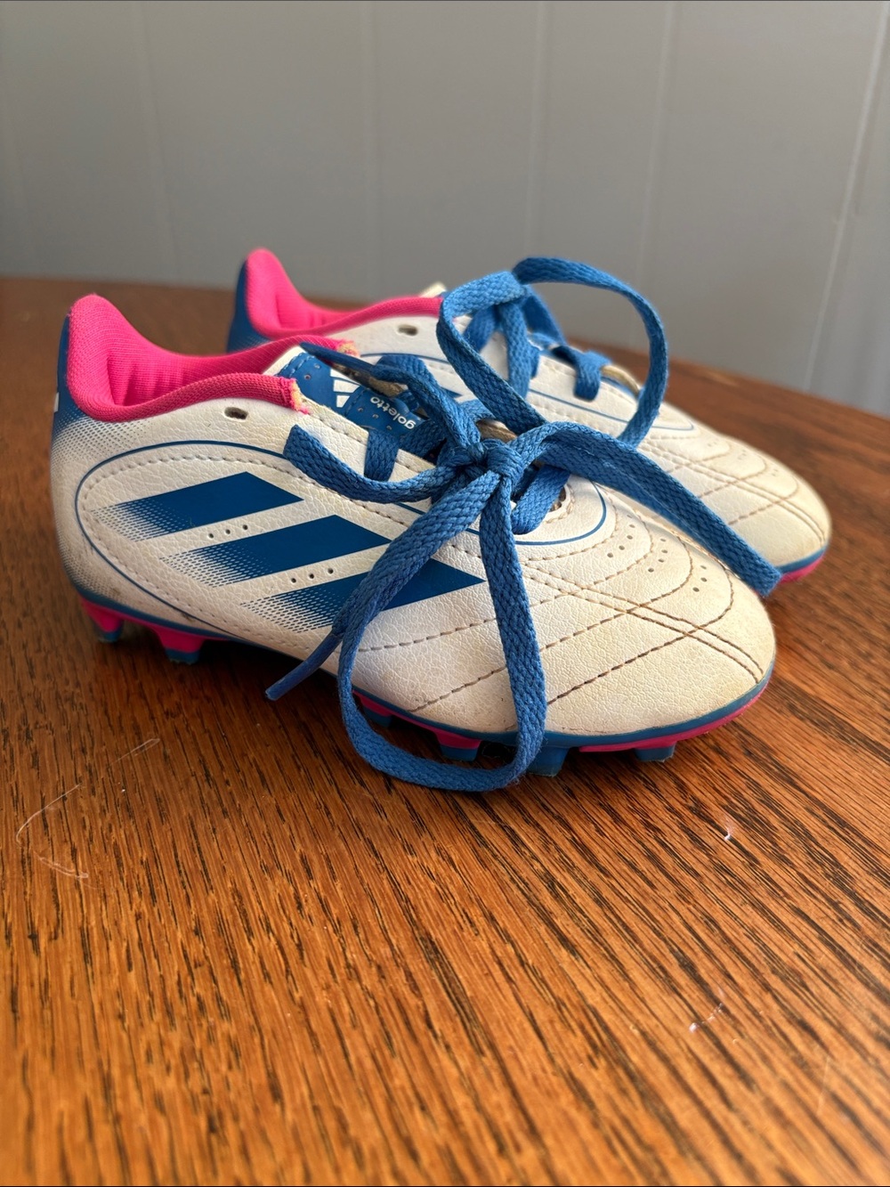 Kids White and Blue Soccer Cleats with Pink Accents